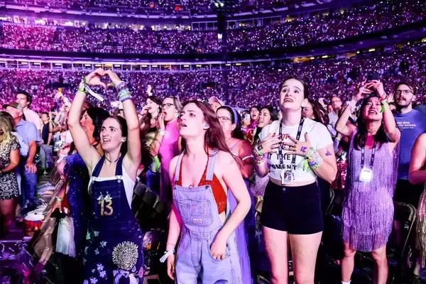 Fans attend "The Eras Tour" at Empower Field At Mile High in Denver in 2023